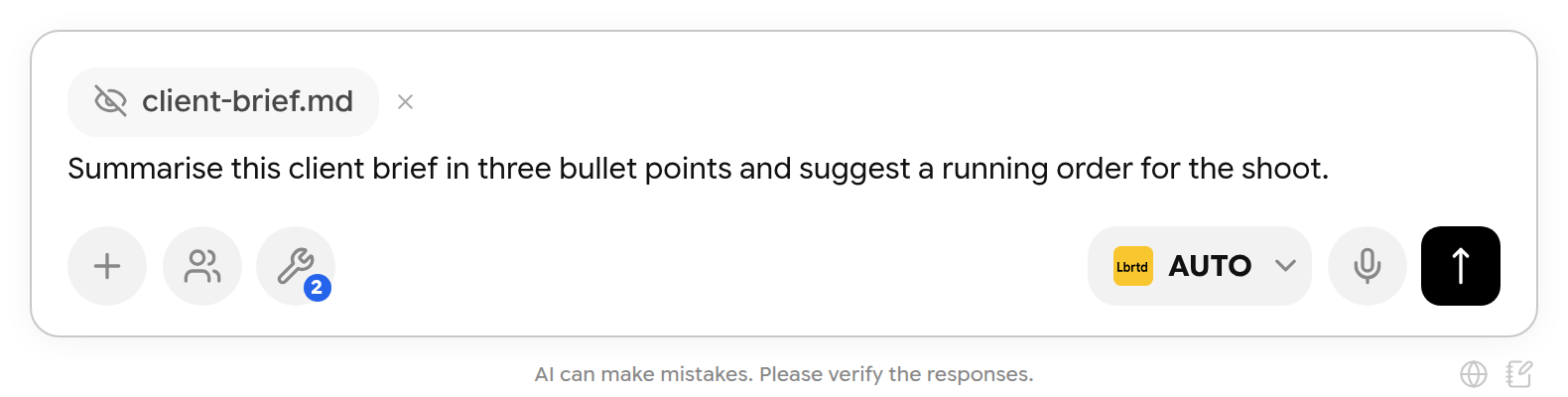 Composer with the redacted client-brief.md chip and a typed request